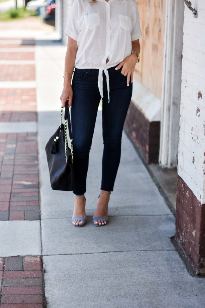 white tie up top ag jeans tory burch bag